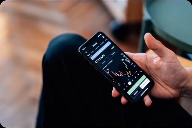 Fintech marketing agency view of a trading app open on a phone